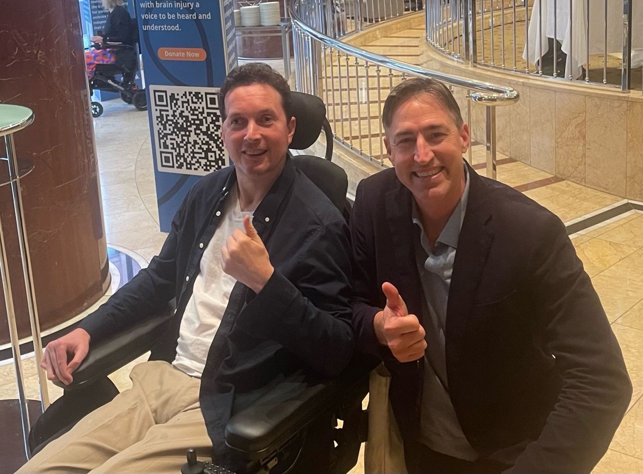 BrainLink ambassador Paul Jamieson posing for a photo with BrainLink board member Clint Bizzell