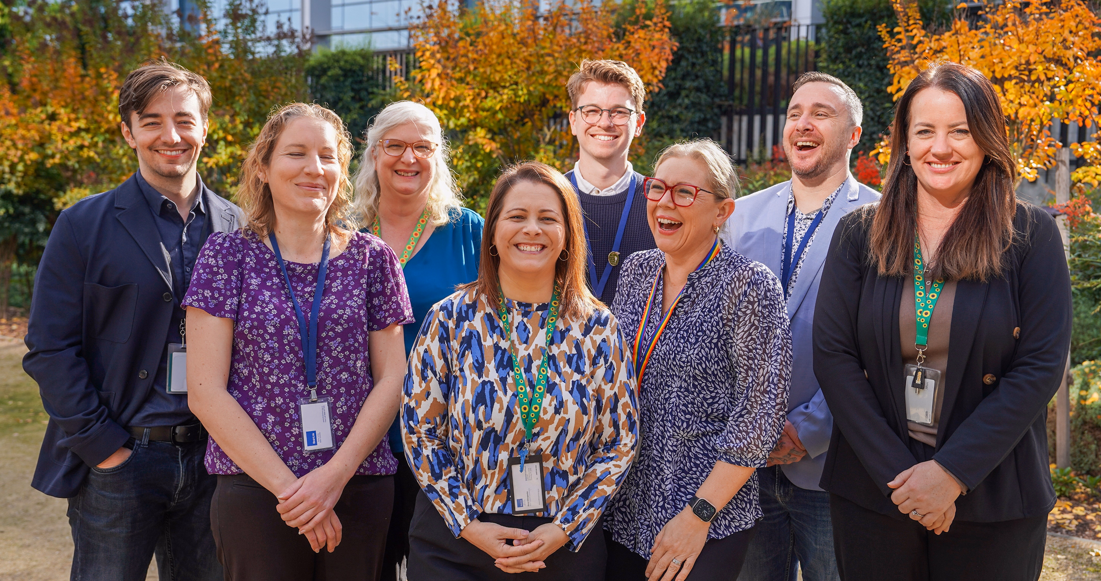 BrainLink NDIS support coordination and carer support staff standing outside office building during team photo.