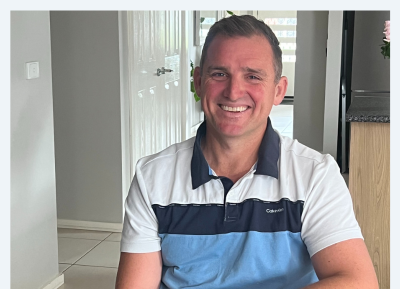 Marcus Whelan smiling and ready to help people living with brain injury.